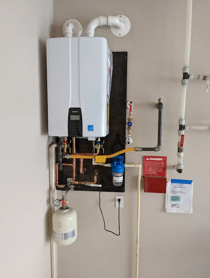 Professional plumber installing copper piping in a East Longmeadow home